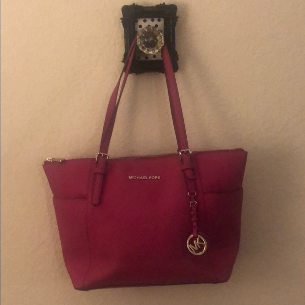 Hot pink Michael Kors Jet Set zip top Purse